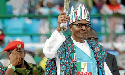  ?? AP ?? Nigeria’s incumbent President, Muhammadu Buhari of the All Progressiv­es Congress Party, centre, during an election campaign rally at the Teslim Balogun stadium in Lagos.