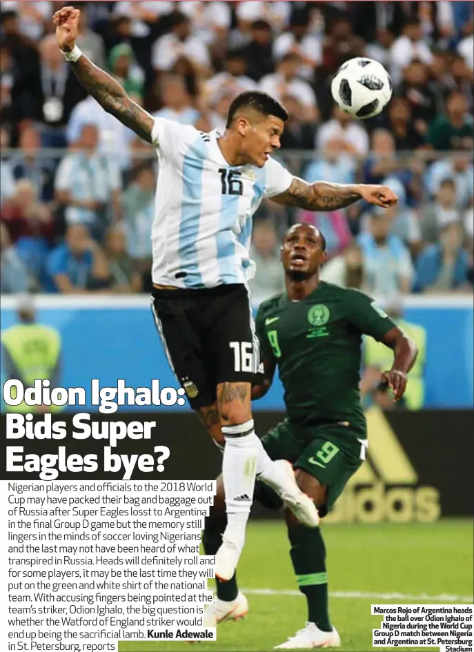  ??  ?? Marcos Rojo of Argentina heads the ball over Odion Ighalo of Nigeria during the World Cup Group D match between Nigeria and Argentina at St. Petersburg Stadium