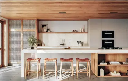  ?? CAESARSTON­E ?? Warm neutrals, like these Mabannova porcelain counters from Caesarston­e, rule in kitchen design this year. The Kintzu faucet is by Brizo.