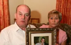  ??  ?? POIGNANT: Stephen and Breege Quinn with a photo of Paul