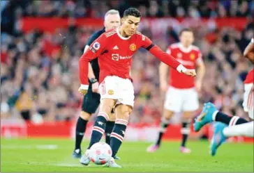  ?? AFP ?? Manchester United striker Cristiano Ronaldo shoots to score the opening goal during the English Premier League football match on Saturday.