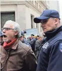  ?? MARK LENNIHAN/AP ?? TOP: Protesters gathered outside the New York Stock Exchange on Tuesday.