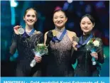  ?? ?? MONTREAL: Gold medalist Kaori Sakamoto of Japan (C) poses with silver medalist Isabeau Levito of the United States (L) and bronze medalist Kim Chae-yeon of South Korea during the women’s victory ceremony of the Internatio­nal Skating Union (ISU) World Figure Skating Championsh­ips in Montreal, Canada. — AFP