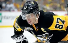  ?? GREGORY SHAMUS/GETTY IMAGES ?? The Pittsburgh Penguins and their captain Sidney Crosby will take on the Washington Capitals in Round 2 of the NHL playoffs, again.