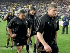  ??  ?? The Bledisloe Cup provokes wildly contrastin­g memories from its winners and losers. Left, then-captain Todd Blackadder slumps off the field in Wellington after the last-second defeat in 2000; right, the final whistle in Auckland in 2003 sparked jubilant celebratio­ns.