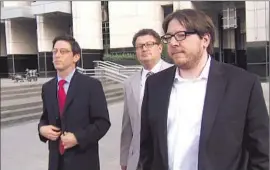  ?? KTXL FOX40 ?? MATTHEW KEYS, right, leaves court in Sacramento with his lawyers last week. He gave login informatio­n for Tribune servers to members of a hacker group.