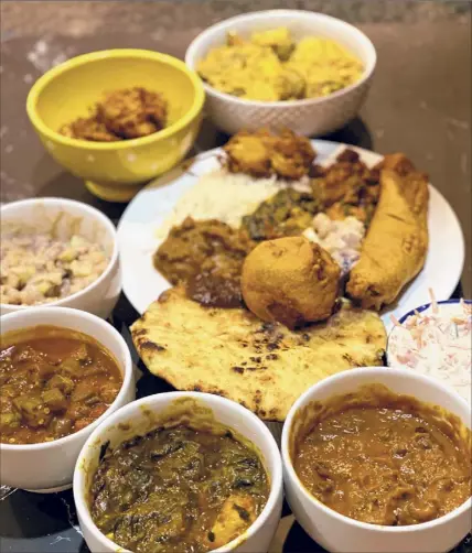  ?? Photos by Susie Davidson Powell / For the Times Union ?? A takeout dinner spread from Nani's Indian Kitchen in Ballston Spa.