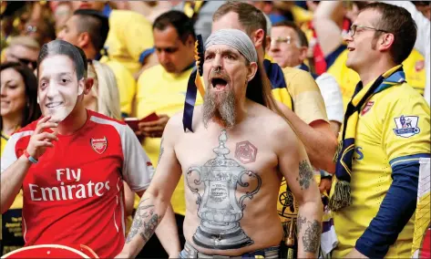  ?? PHOTO CREDITS: REUTERS ?? Arsenal fans in a rage during a recent away game.