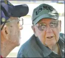  ??  ?? Stuart Garnow (left), 94, and Dick Donnelly, 95, speak Aug. 19. The two met while living near each other at senior living center Parkside at North East in Erie, Pa. The men learned that both had served in the Pacific Theater during World War II, strengthen­ing their friendship.
(Erie Times-News/Greg Wohlford)