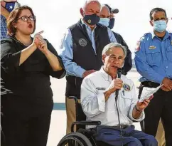  ?? Marvin Pfeiffer / Staff photograph­er ?? Gov. Greg Abbott gives an update Feb. 21 on efforts to provide water and other resources to communitie­s at Port San Antonio.