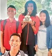  ??  ?? P. V. Sindhu is jubilant as she poses with a special cake brought by her Indonesian fans in Jakarta for her birthday on Thursday.