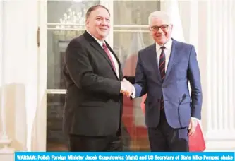  ??  ?? WARSAW: Polish Foreign Minister Jacek Czaputowic­z (right) and US Secretary of State Mike Pompeo shake hands during a joint press conference yesterday. — AFP