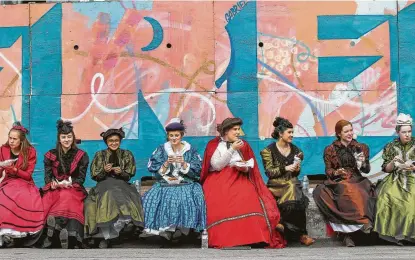  ?? Steve Gonzales / Staff photograph­er ?? Members of the Kingwood Park High School Madrigal singers take a lunch break from singing holiday carols during the Galveston HIstorical Foundation’s Dickens on the Strand festival. Today is the last day of the festival.