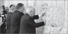  ?? [ABIR SULTAN/POOL PHOTO] ?? From left, Israeli Prime Minister Benjamin Netanyahu, U.S. Secretary of State Mike Pompeo and U.S. Ambassador to Israel David Friedman pray Thursday at the Western Wall in Jerusalem’s Old City.