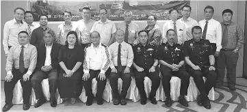  ??  ?? Nicholas (seated fifth left) with other invited guests and participan­ts of the forum.