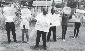  ?? (Photo by Keno George) ?? Some of the protestors outside GPSU yesterday as they fervently called for Patrick Yarde to be replaced as president of the union.