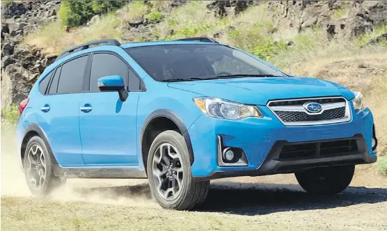  ?? SUBARU CANADA ?? Ramping up the rugged, outdoorsy factor, the 2016 Subaru Crosstrek wears a tough body cladding and rides on unique, chunky wheels.