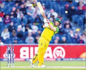  ?? PAUL ELLIS/AFP ?? Australia’s David Warner plays a shot and is caught out during the Cricket World Cup match agianst South Africa at Old Trafford in Manchester on Saturday.