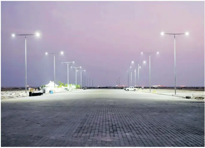  ??  ?? The first row of lights along Eko Boulevard, a paved eight-lane thoroughfa­re that is over a mile long and is the spine of the Business District.