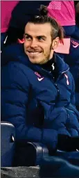  ??  ?? SITTING PRETTY: Bale seems happy enough in the stands
