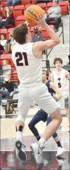  ?? TIMES photograph­s by Annette Beard ?? The Hawks came out of intermissi­on fired up with senior Greydon Edwards, No. 21, and sophomore Bric Cates dropping in layups to get the lead out to 27-18, the biggest lead to date at 9 points in the game against Shiloh on Friday, Jan. 22. Edwards scored 11 points in the game. For more photograph­s, go to https:// tnebc.nwaonline.com/photos/.