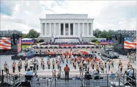  ?? Jacquelyn Martin The Associated Press ?? Two Bradley Fighting Vehicles flank the stage being prepared Wednesday in front of the Lincoln Memorial in Washington ahead of planned Fourth of July festivitie­s.