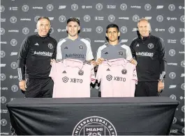  ?? Inter Miami CF ?? Inter Miami coach Phil Neville, left, and sporting director Chris Henderson, right, introduce new Argentine players Franco Negri (next to Neville) and Nico Stefanelli.