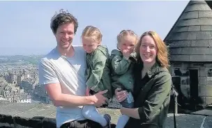  ??  ?? ●●Damon Wilkinson, with wife Helen and daughters Mae and Neve at Edinburgh Castle