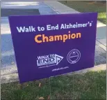  ?? ?? A Walk to End Alzheimer’s sign from a White Horse Village community walk in 2021.