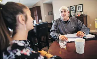  ?? GEOFF ROBINS/THE CANADIAN PRESS ?? FCA worker Mike Malott, with his daughter Jada, 14, worries he’d find it tough to find an equivalent job if the U.S. slaps penalties on auto imports that could drive plants out of Windsor.