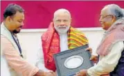  ?? PTI FILE ?? Prime Minister Narendra Modi felicitate­s descendant­s of Paika warriors from Odisha in Bhubaneswa­r in April.