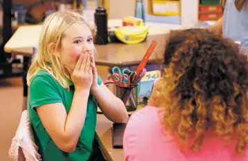  ?? LUIS SÁNCHEZ SATURNO/THE NEW MEXICAN ?? Sixth-grader Cora Bixby, 11, reacts Thursday after learning her school, Wood Gormley Elementary, has been named a Blue Ribbon School.