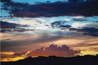  ?? Staff file photo ?? Sunset in El Paso once offered respite from the summer heat, but that is changing in a warming world. Climate change threatens life — and that which makes life worth living.