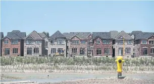  ?? STEVE RUSSELL TORONTO STAR FILE PHOTO ?? Parts of Canada’s housing market are showing strain, but one group isn’t buying into dire warnings about the end of a decades-long boom: the bankers writing most of the mortgages.