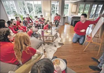  ?? Photograph­s by BRIAN VAN DER BRUG Los Angeles Times ?? COREY MOSS leads a math lesson for third-, fourth- and fifth-graders in his living room in Encino.