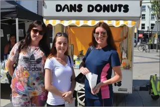  ??  ?? ABOVE: Helena Coffey, Kim O’Connell and Bridget Coffey pictured enjoying some of Dan’s Donuts at the inaugural Tralee Square Market on Thursday.