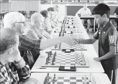  ??  ?? During a strong grandmaste­r chess tournament two weeks ago in Vlissingen, Netherland­s, 12year-old Indian Internatio­nal Master R Praggnanan­dhaa (right) played a 20-board clock simultaneo­us exhibition against some recognized Dutch chess players. ‘Pragg’...