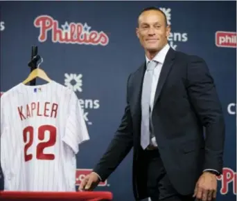  ?? MATT ROURKE — THE ASSOCIATED PRESS ?? New Phillies manager Gabe Kapler walks onto the stage for a news conference Thursday in Philadelph­ia. Kapler replaces Pete Mackanin, who moved into a front-office position.