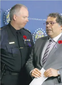  ?? JIM WELLS/FILES ?? Police Chief Roger Chaffin, left, seen here with Mayor Naheed Nenshi in November, admitted to council on Monday that changes have to be made to address the record number of police shootings in 2016.