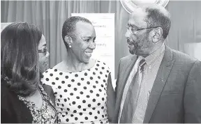  ?? HEMANS/PHOTOGRAPH­ER KENYON ?? From left: Jennifer McDonald, chief executive officer, Private Sector Organisati­on of Jamaica (PSOJ); Fayval Williams, minister without portfolio in the Ministry of Finance and the Public Service; and Howard Mitchell, president of the PSOJ, discuss the...