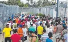  ??  ?? DESPERATE: Asylum seekers at the detention centre on Manus Island.