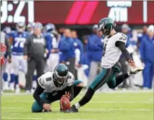  ?? JOHN BLAINE — FOR THE TRENTONIAN ?? Eagles kicker Jake Elliott (4) boots the ball through the uprights for a field goal as punter Donny Jones (8) holds during a game against the Giants on Sunday afternoon.