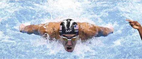  ??  ?? THIS FILE PHOTO taken on Aug. 11 shows USA’s Michael Phelps (top) competing in the Men’s 200m Individual Medley Semifinal during the swimming event at the Rio 2016 Olympic Games at the Olympic Aquatics Stadium in Rio de Janeiro. Jamaica’s Usain Bolt...