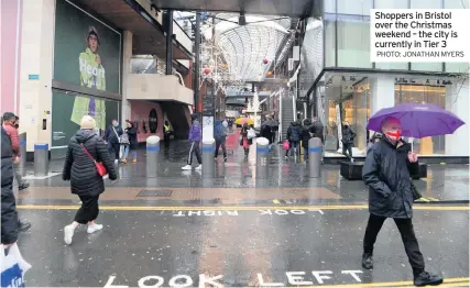  ?? PHOTO: JONATHAN MYERS ?? Shoppers in Bristol over the Christmas weekend – the city is currently in Tier 3