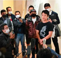  ?? AFP PHOTO ?? A DANGEROUS PROFESSION
Japanese journalist Toru Kubota (center) speaks to the media upon his arrival at Tokyo’s Haneda Airport after being released from a Myanmar prison in Tokyo, Japan on Friday, Nov. 18, 2022.