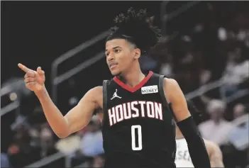  ?? AP PHOTO/ERIC CHRISTIAN SMITH ?? Houston Rockets guard Jalen Green reacts after making a 3-point basket during the second half of the team’s NBA basketball game against the Minnesota Timberwolv­es, on Sunday in Houston.