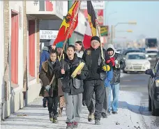  ?? BRANDON HARDER ?? Activists march down a Regina street on Friday protesting the verdict in the Tina Fontaine case in Winnipeg. On Thursday, a jury found Raymond Cormier not guilty in the death of the 15-year-old.