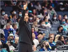  ?? MATT KELLEY/ASSOCIATED PRESS ?? Charlotte Hornets head coach James Borrego calls for a play during the first half of his 100th career win, this one 125-113 over Portland on Sunday. The Hornets are 5-2.