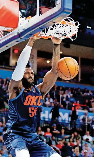 ?? [PHOTO BY NATE BILLINGS, THE OKLAHOMAN] ?? Oklahoma City’s Patrick Patterson dunks during Sunday night’s game against the Phoenix Suns at Chesapeake Energy Arena. The Thunder won, 117-110.