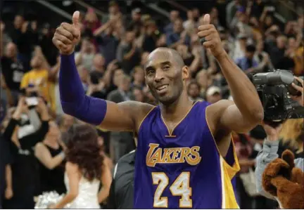  ?? DARREN ABATE — ASSOCIATED PRESS ?? Los Angeles Lakers guard Kobe Bryant gestures to fans as he walks off of the court after his team’s game with the San Antonio Spurs in San Antonio on Saturday. He will play in his final NBA All-Star Game on Sunday.